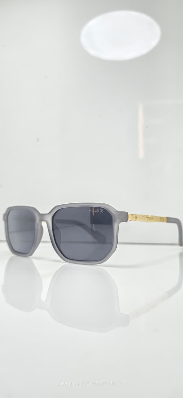 POLICE Sunglasses - Bold Design with Gold Temple Accent & Polarized Lenses.