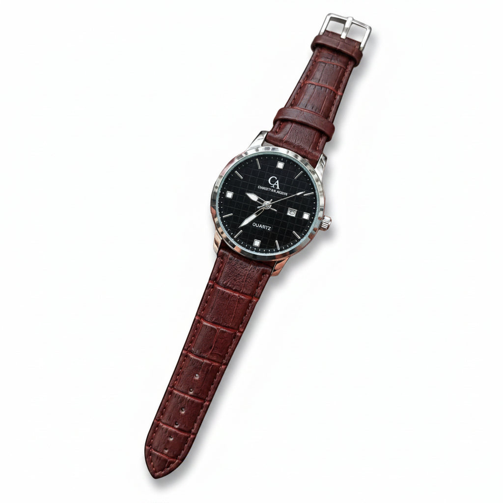 A wristwatch with a black dial and a brown textured leather strap, held in a person's hand against a gray concrete background.