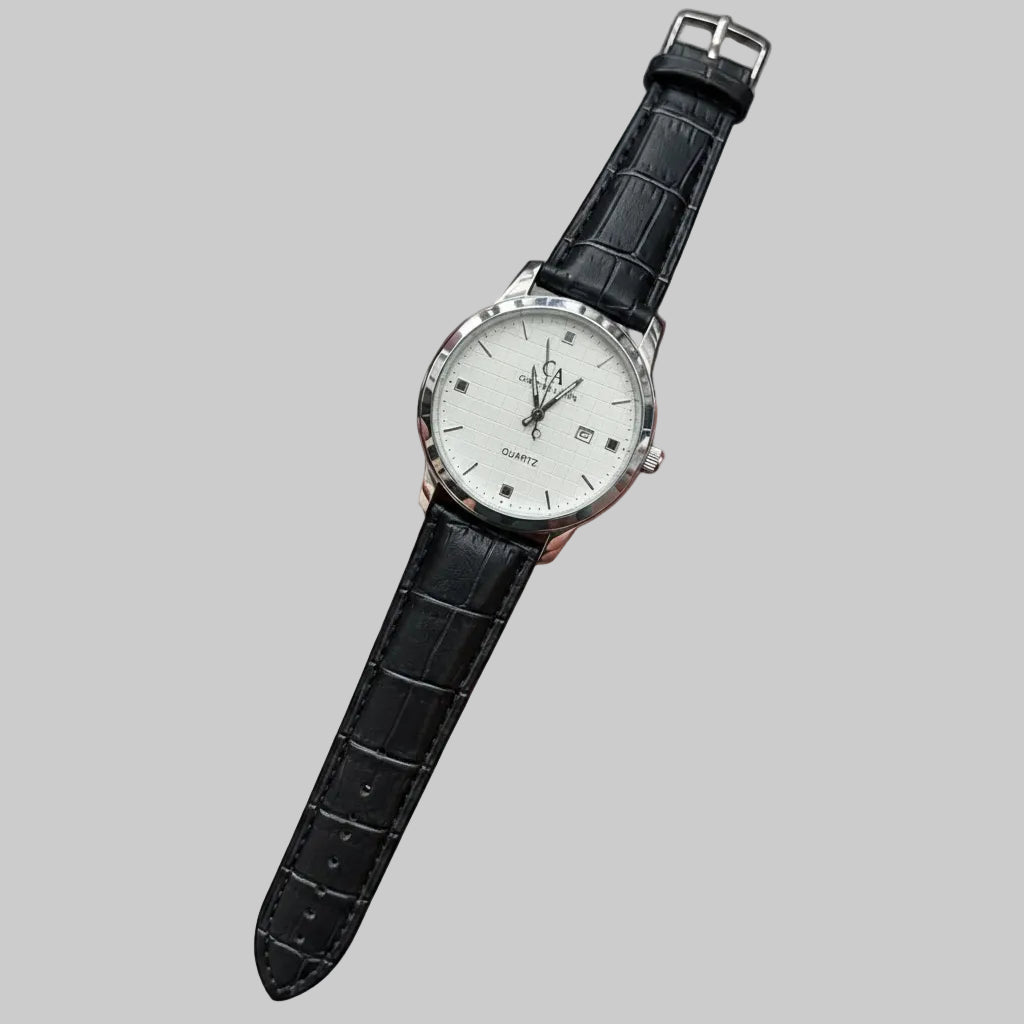 A wrist watch with a silver-tone case, white dial, and black textured leather strap, shown diagonally on a plain white background.